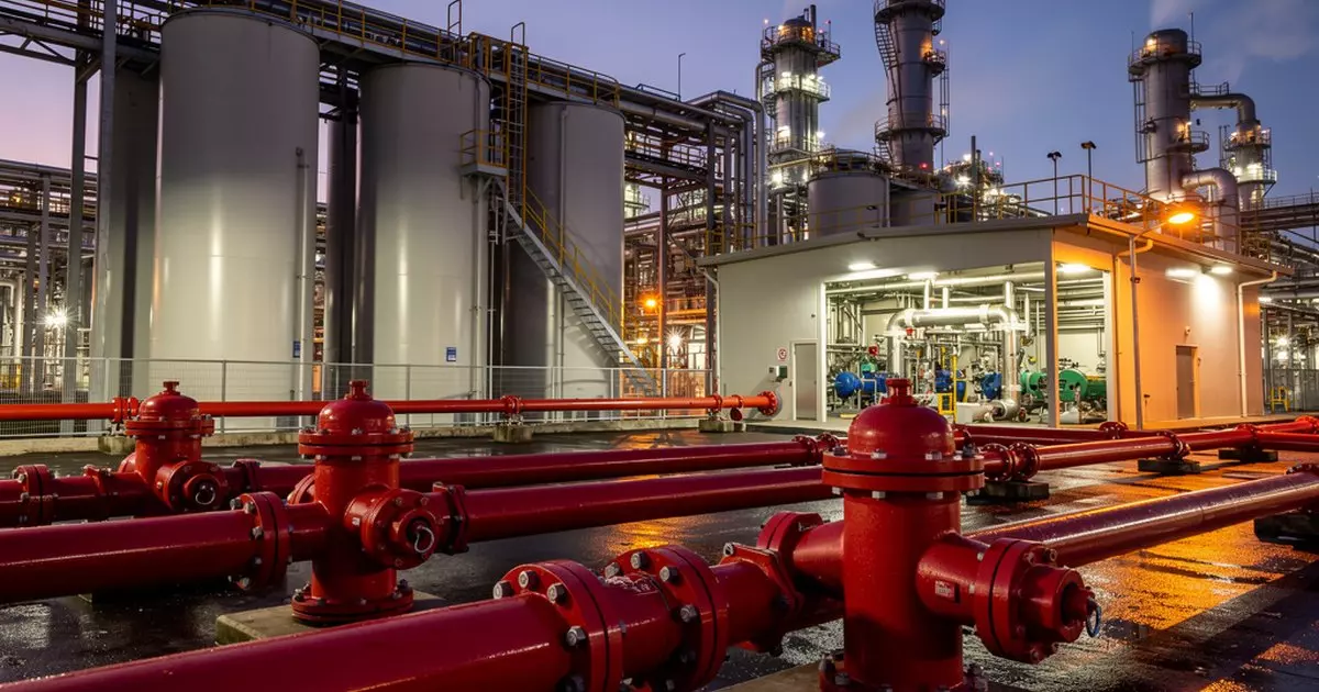 Industrial fire water supply system with hydrants, underground mains, and pump house at a petrochemical refinery