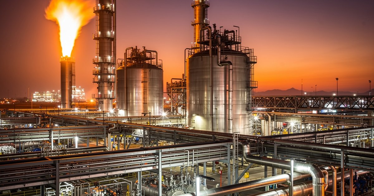 Industrial refinery pressure vessels and relief valve systems at twilight
